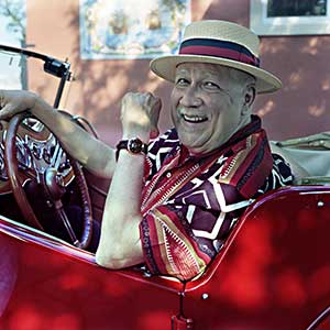 Paquito D'Rivera in Red convertible car