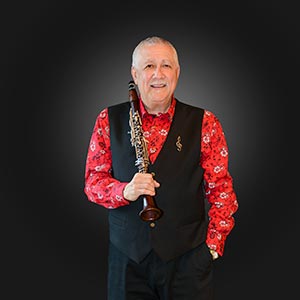Paquito D'Rivera standing portrait with clarinet